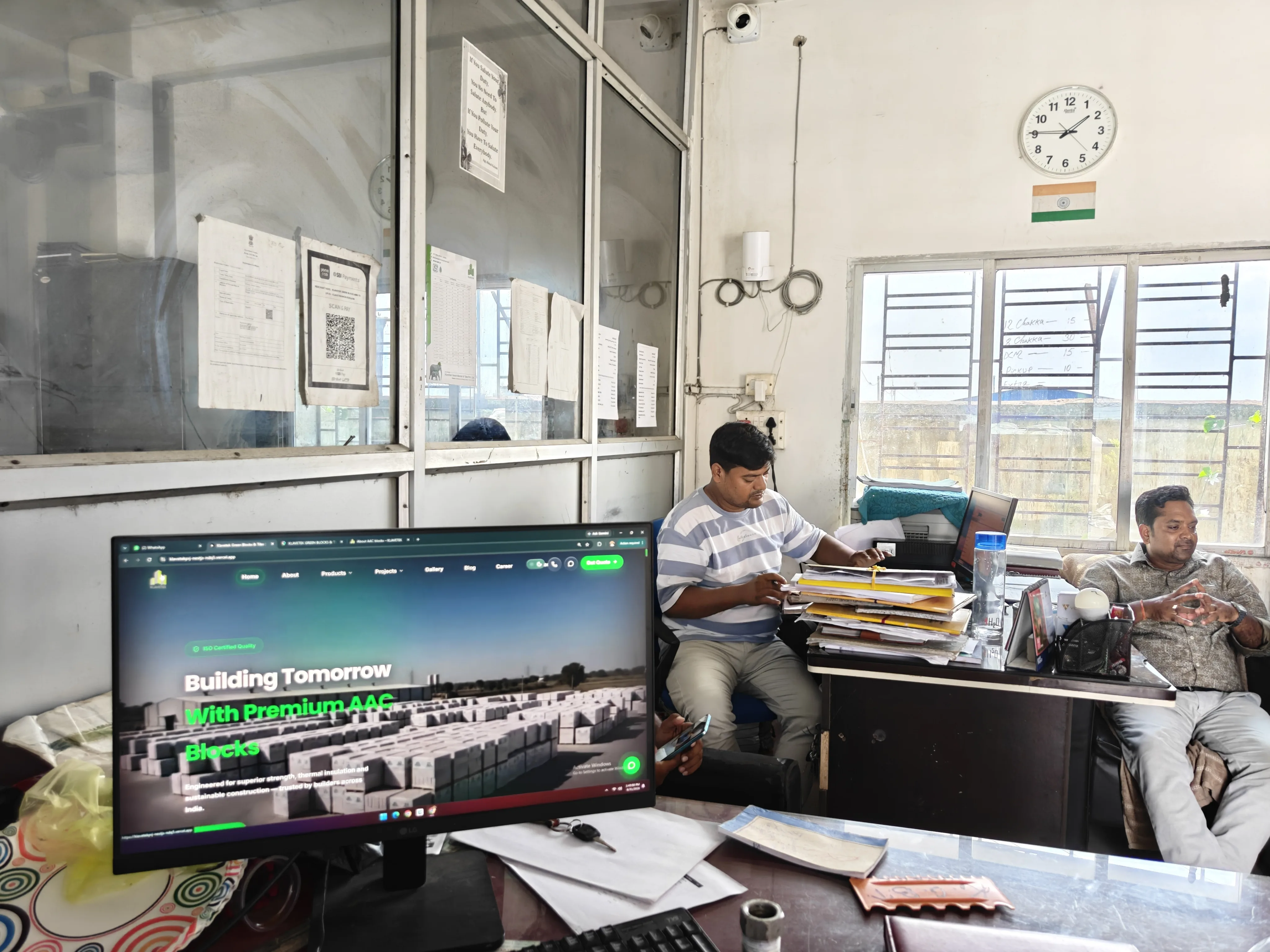 Klavetek office with the company website on screen