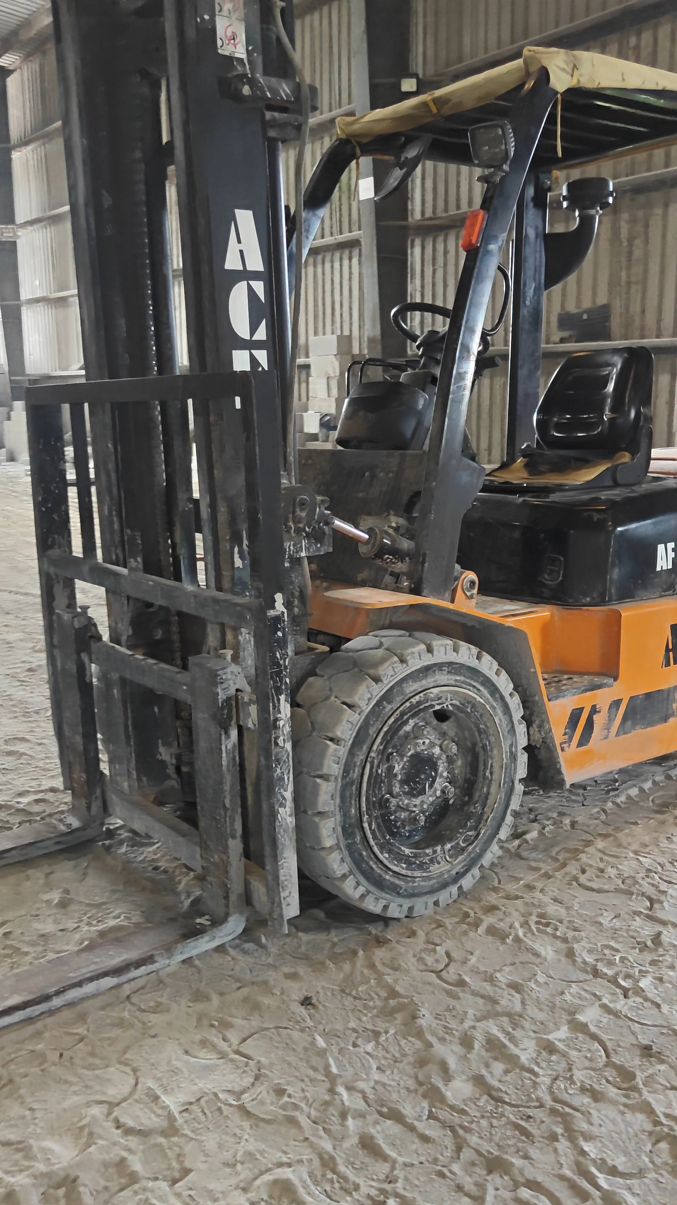 ACE forklift lifting a stack of finished AAC blocks