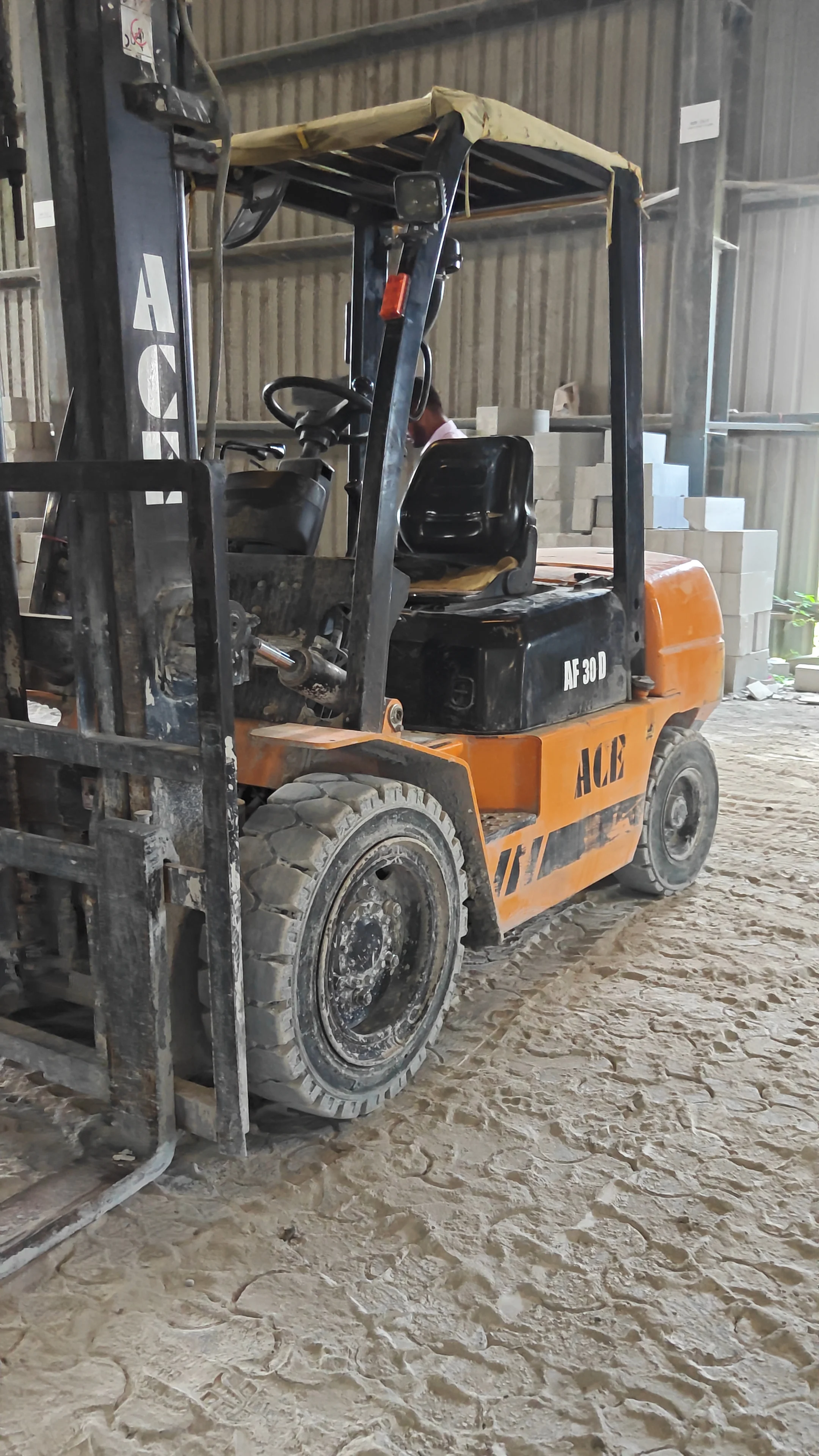 ACE handling equipment moving AAC blocks across the yard