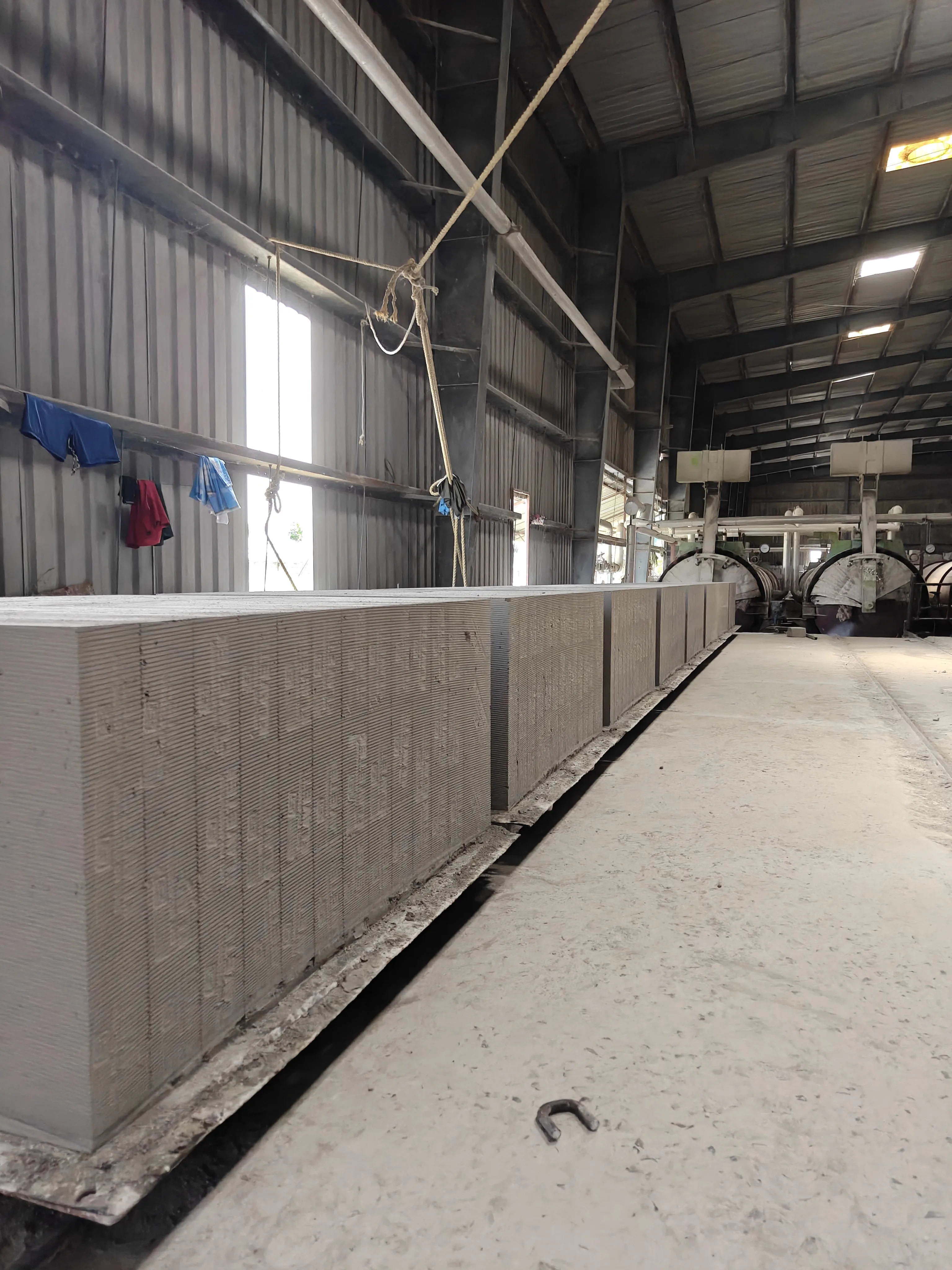 Aerated AAC cakes on rails ready for autoclaving